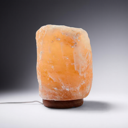 Himalayan salt lamp on a gray background